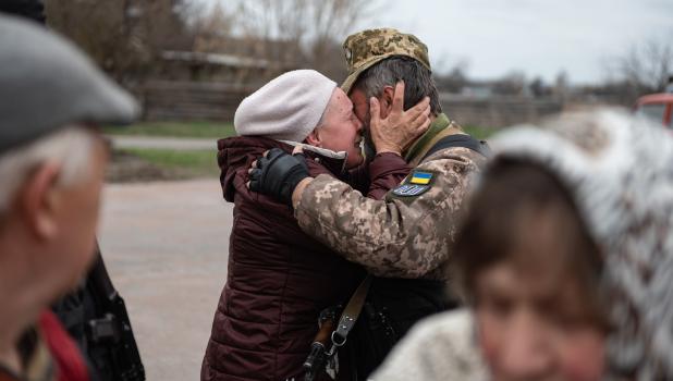 A Ukrainian refugee says goodbye before leaving for the Netherlands