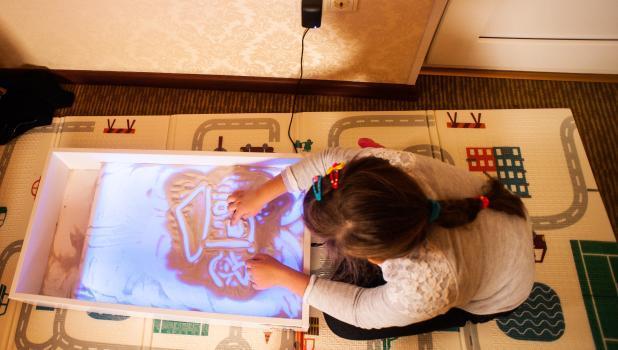 Girl Valentina making art work